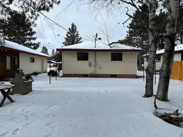 view of snow covered house