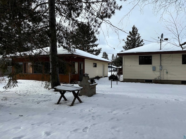 view of snow covered house