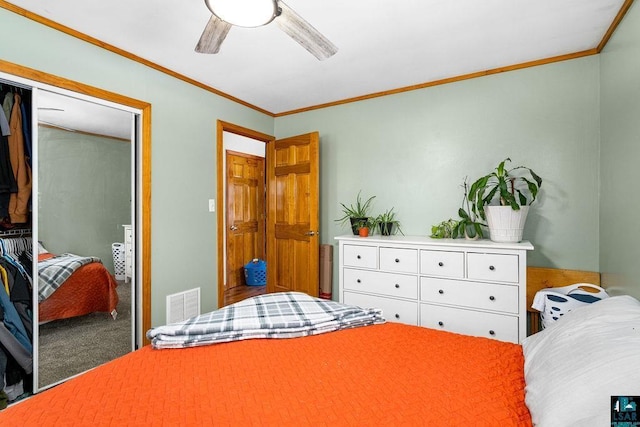 bedroom featuring carpet flooring, ceiling fan, and crown molding