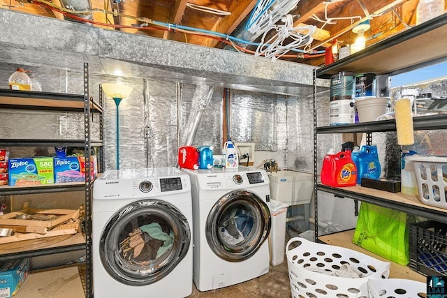 clothes washing area featuring washing machine and dryer