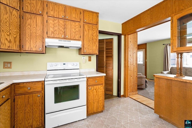 kitchen featuring white range with electric stovetop