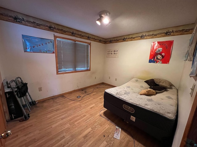 bedroom featuring light wood-type flooring