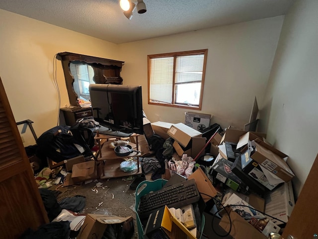 miscellaneous room featuring a textured ceiling