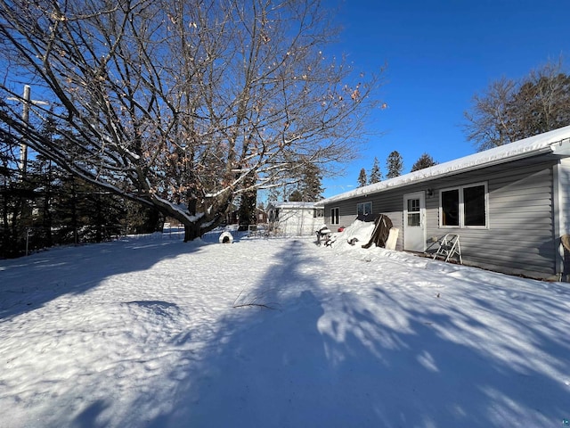 view of yard covered in snow