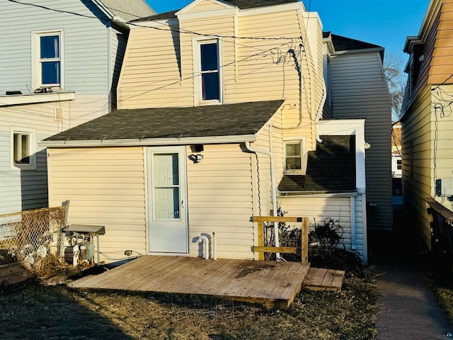 rear view of property featuring a deck