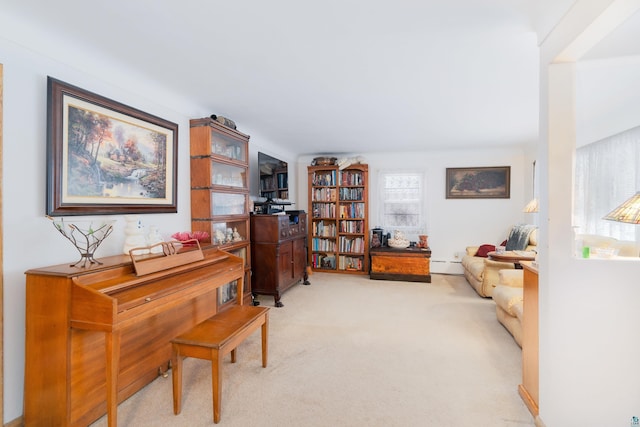 miscellaneous room with light colored carpet and baseboard heating