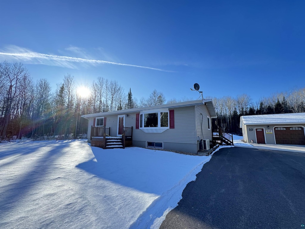 view of front of home with cooling unit