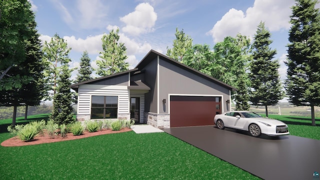 view of front of home with a garage and a front lawn