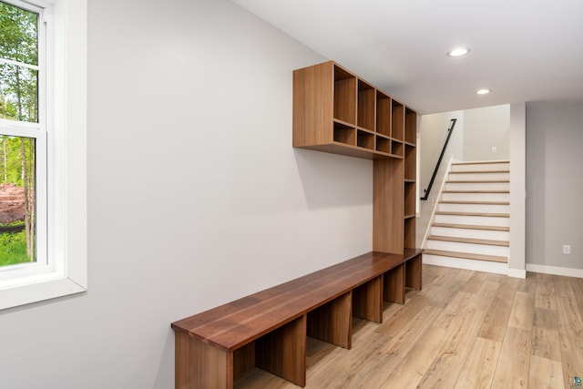 mudroom with light hardwood / wood-style floors