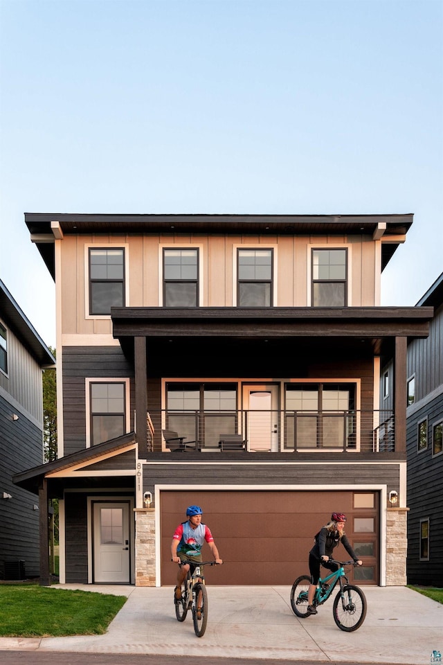 view of front of home with cooling unit and a balcony