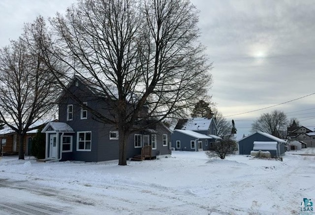 view of front of property with an outdoor structure and a garage