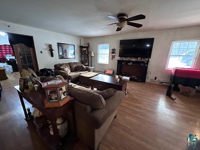 living room with hardwood / wood-style floors and ceiling fan