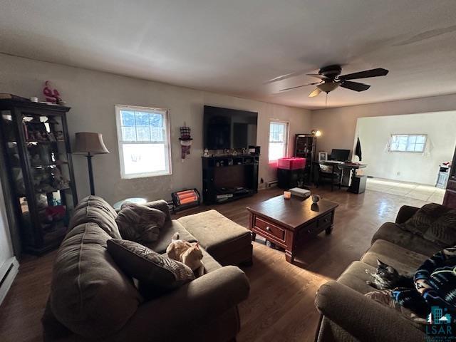 living room with ceiling fan, a healthy amount of sunlight, and wood-type flooring