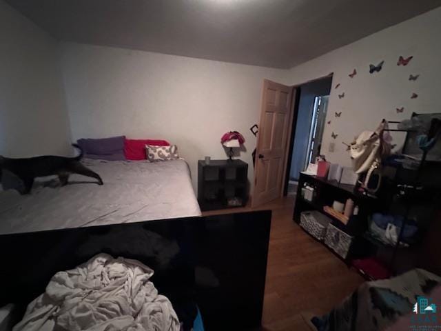 bedroom featuring wood-type flooring