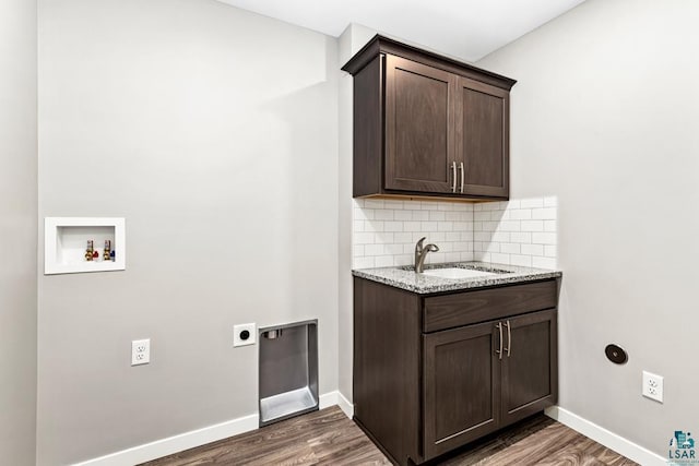 laundry room with cabinets, hookup for a washing machine, dark hardwood / wood-style flooring, electric dryer hookup, and sink