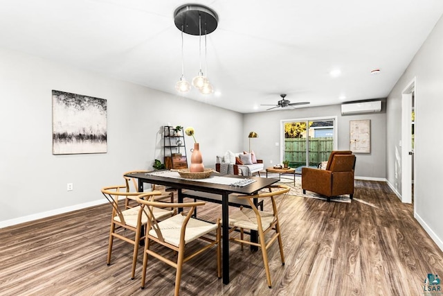 dining room featuring ceiling fan, dark hardwood / wood-style flooring, and a wall mounted AC