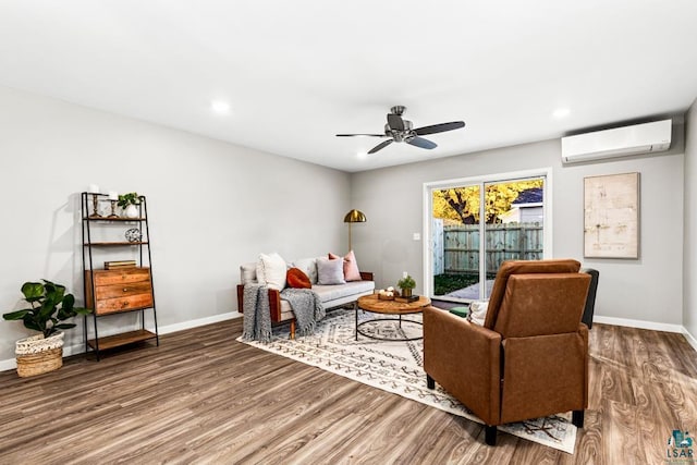 living room with a wall mounted AC, ceiling fan, and hardwood / wood-style floors