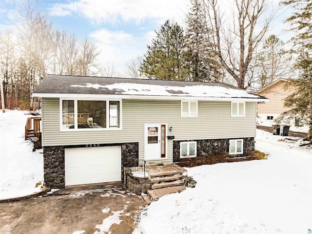 bi-level home featuring a garage