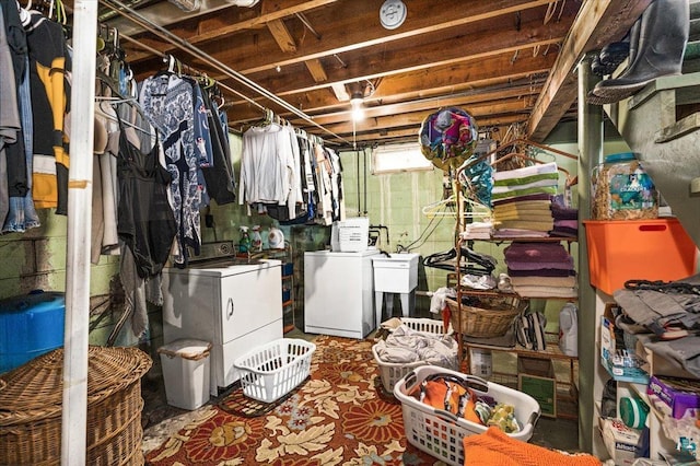 basement featuring washer and dryer and sink