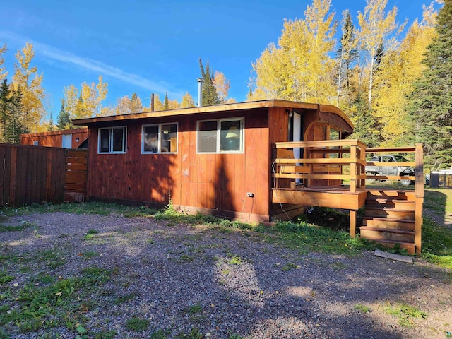 view of side of property featuring a deck