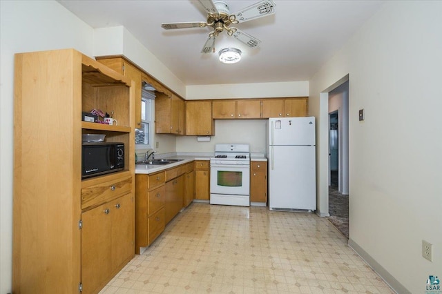 kitchen with white appliances, ceiling fan, and sink