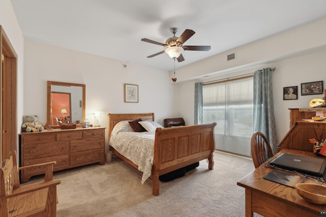 bedroom with light carpet and ceiling fan