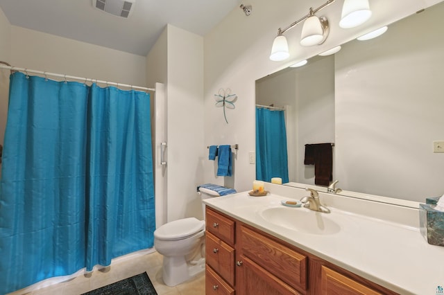 bathroom featuring tile patterned flooring, vanity, a shower with shower curtain, and toilet