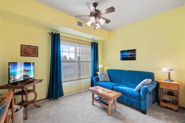 living room with carpet and ceiling fan