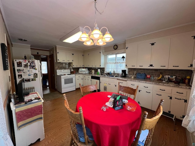 kitchen featuring tasteful backsplash, ornamental molding, white appliances, dark wood-type flooring, and white cabinets