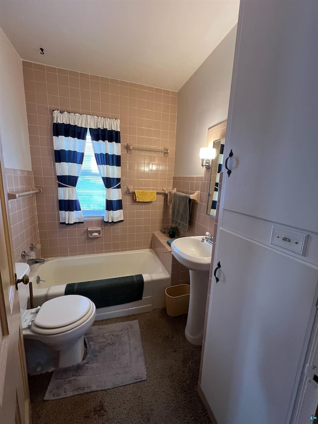 bathroom with shower / bath combo, toilet, and tile walls