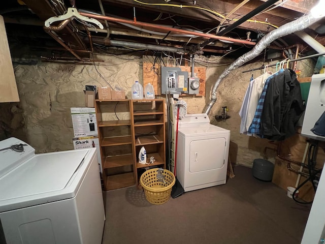 washroom with separate washer and dryer and electric panel