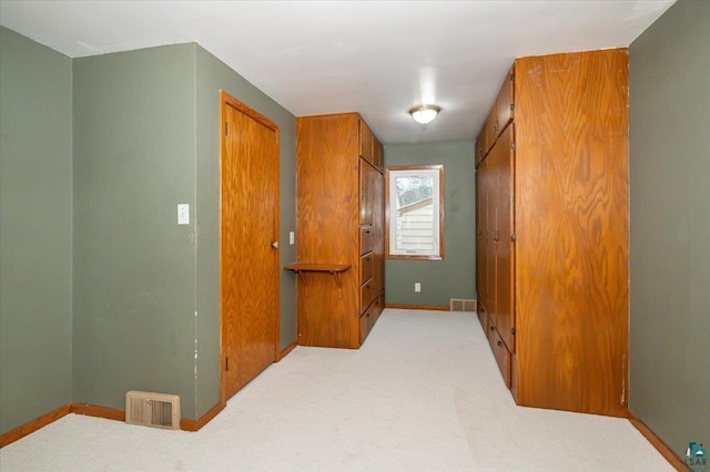 hallway with light carpet