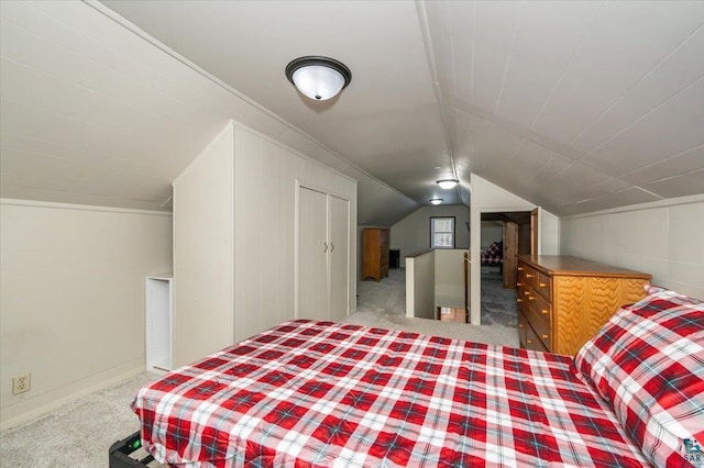 bedroom featuring carpet floors and lofted ceiling