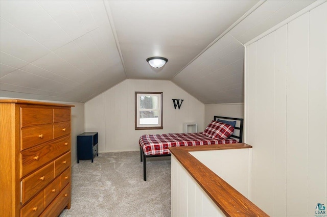 carpeted bedroom with vaulted ceiling