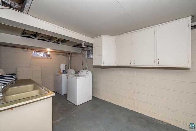 basement with sink and washing machine and clothes dryer