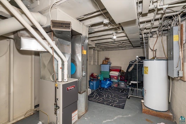 utility room featuring gas water heater and heating unit