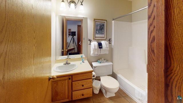 full bathroom featuring toilet, vanity, tile patterned floors, and shower / bathtub combination