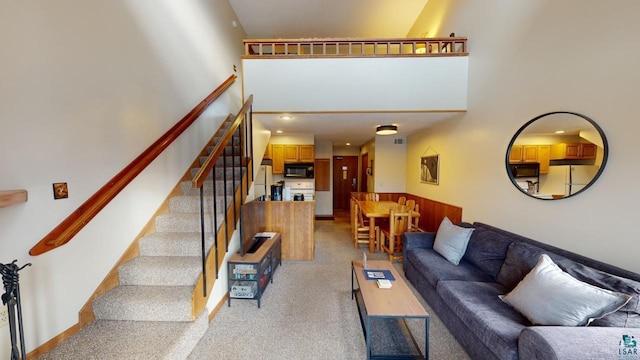 living room with a high ceiling