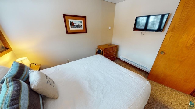 carpeted bedroom with a baseboard radiator