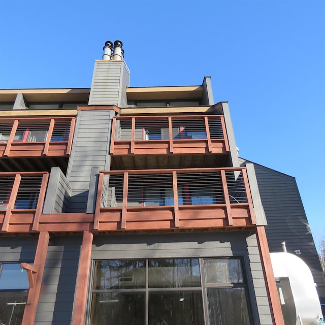 back of house with a balcony