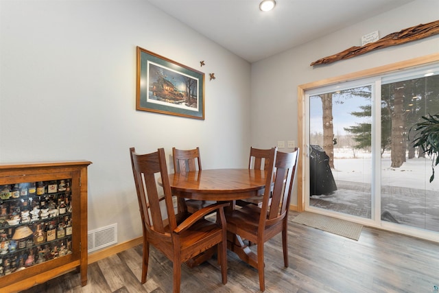 dining area featuring hardwood / wood-style floors