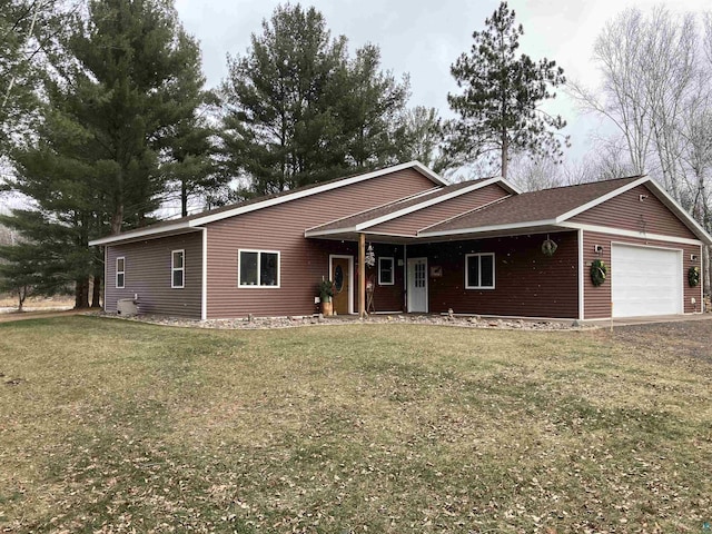 ranch-style house with a front yard and a garage