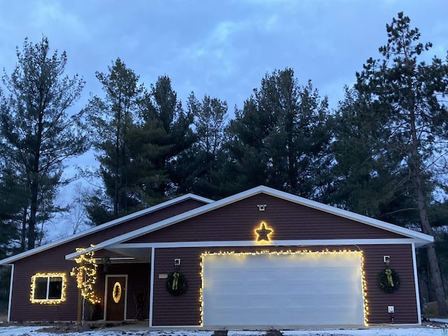 single story home with a garage