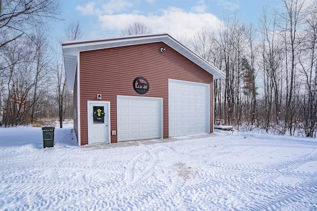 view of snow covered garage