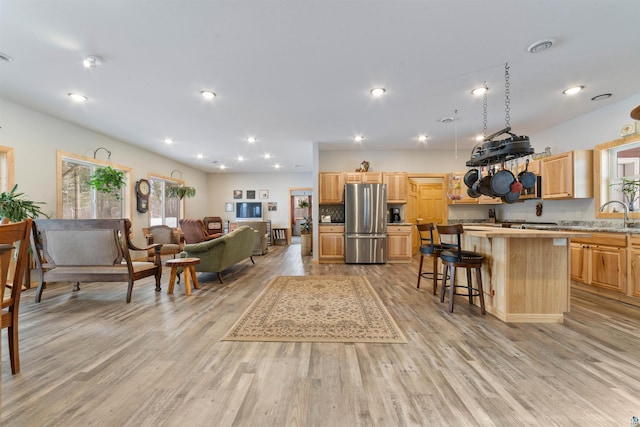 interior space with light hardwood / wood-style flooring and sink