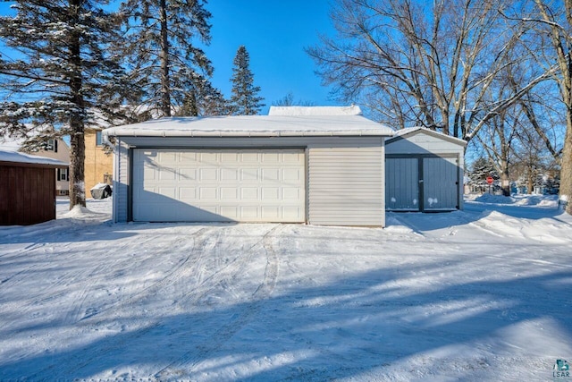 view of snow covered garage