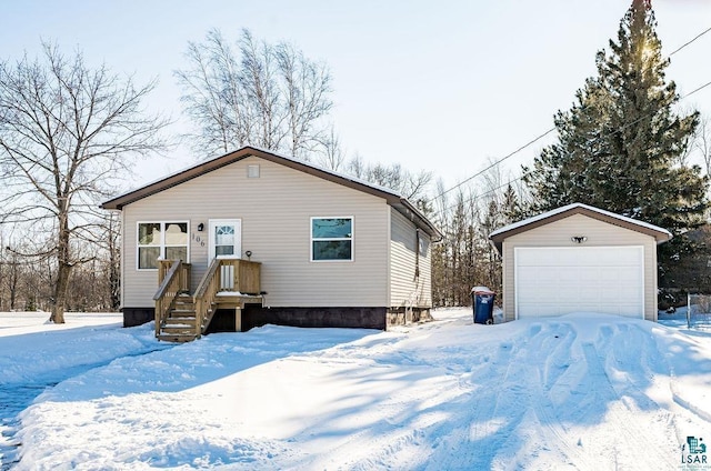 view of front facade with an outbuilding and a garage