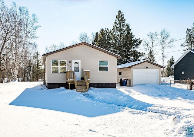 view of front of home featuring a garage and an outdoor structure