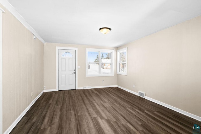 foyer entrance with dark hardwood / wood-style flooring