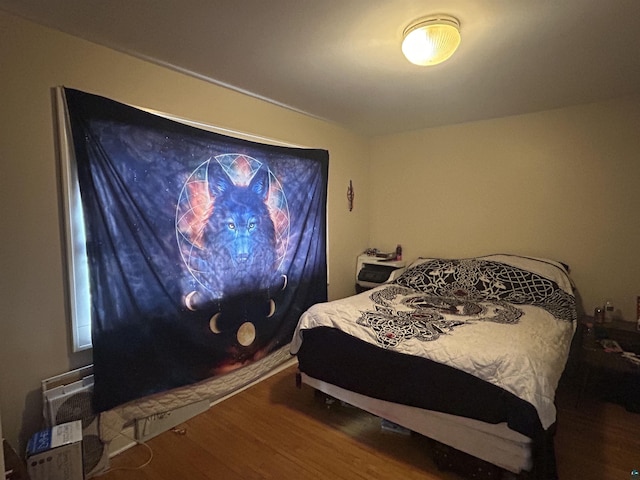 bedroom featuring hardwood / wood-style floors